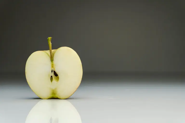 Apple cut in half, showing its seeds